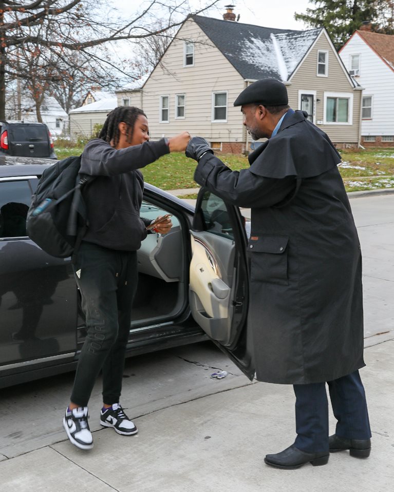 Image of Ralph Johnson and a student
