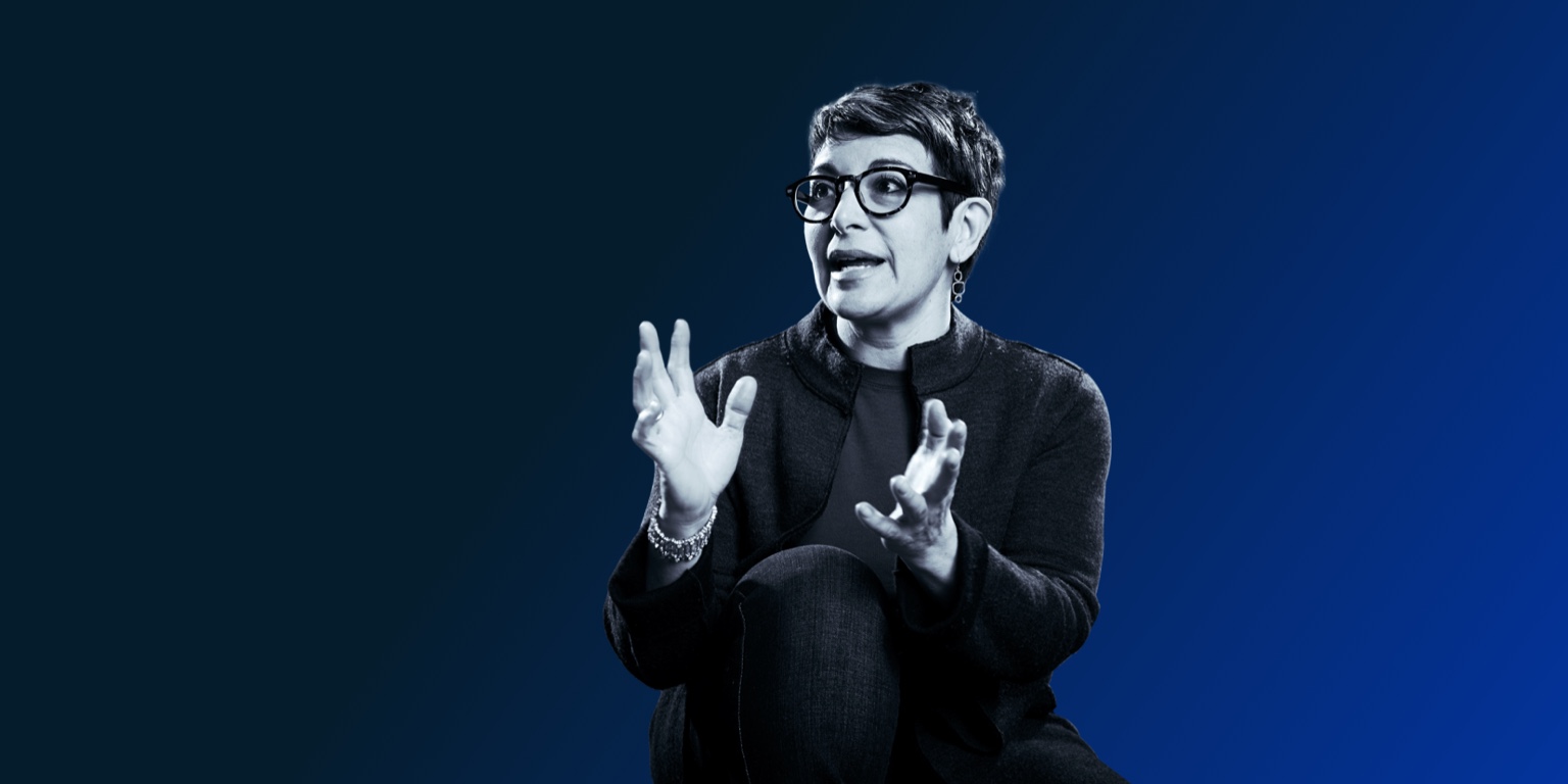a woman gesticulating as she speaks