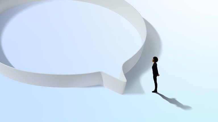 Woman in black standing near a circular hoop