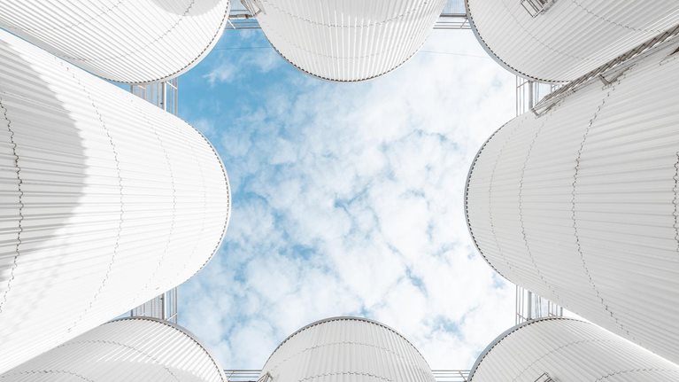 The abstract pattern formed by the storage tanks of the brewery under the blue sky - stock photo
