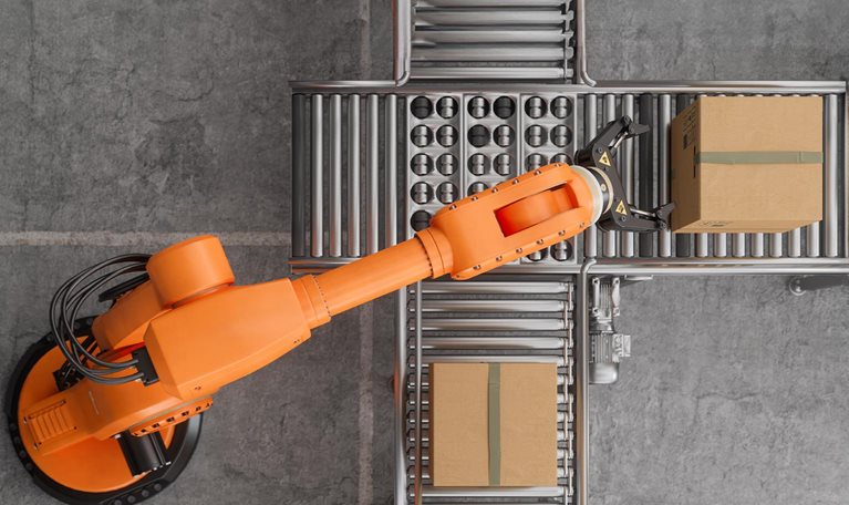 Top view of robotic arm working on conveyor belt In smart warehouse.