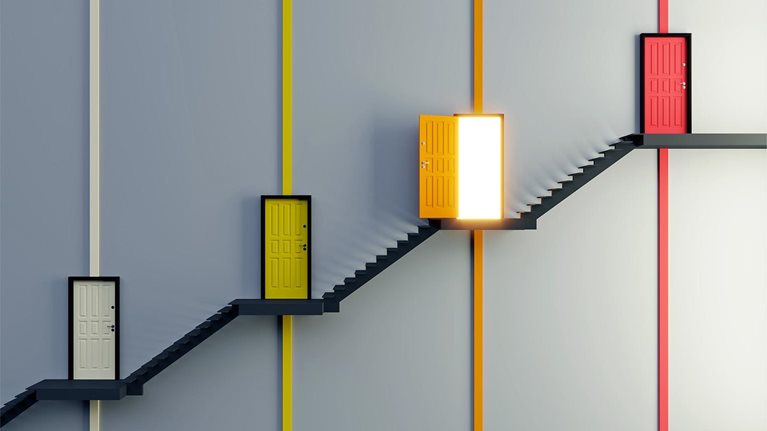 An abstract staircase with multi colored doors on different flights and one door is open with light coming out.