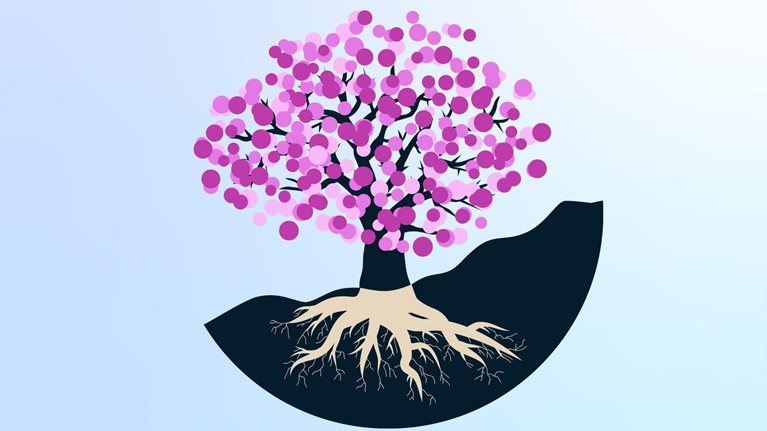 Vector illustration of a tree with blossoms and roots going into the ground.