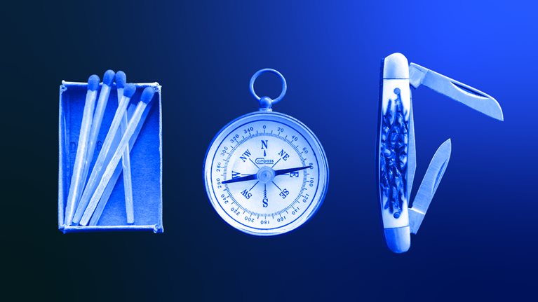 Matchsticks, compass and knife on wooden board