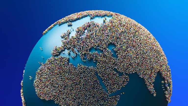 3-D globe with people people scattered around, forming the land.