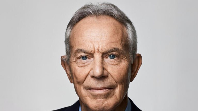 Close-in portrait of Tony Blair with a direct, steady gaze.