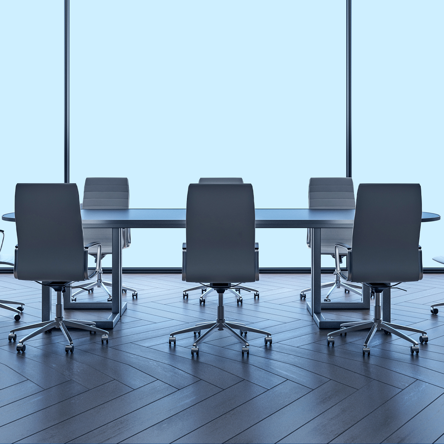 A modern boardroom table and chairs with large windowpanes behind it.