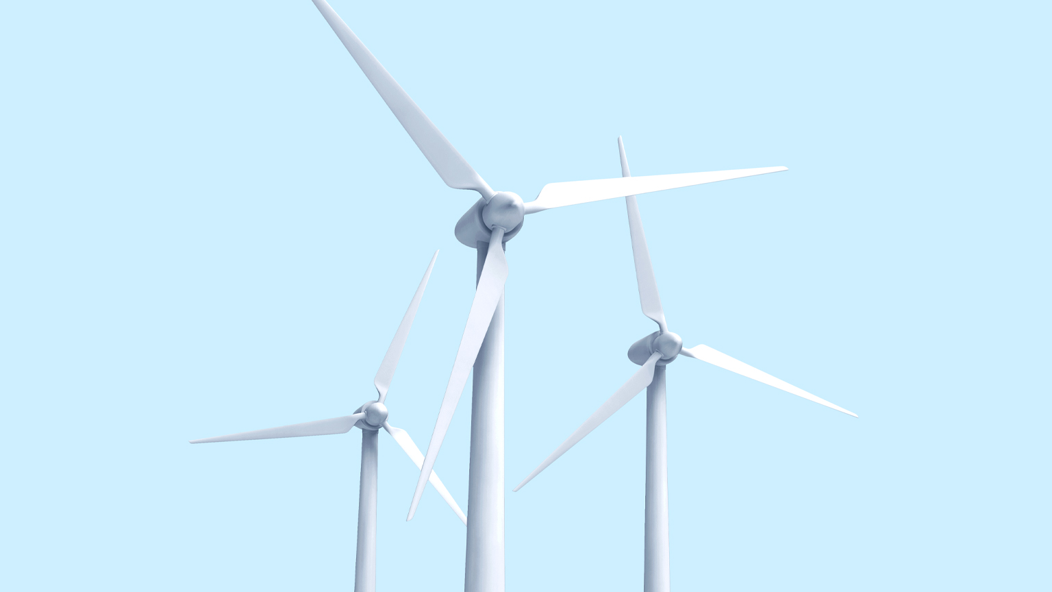 3 wind turbines against a light blue sky. 