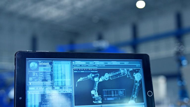 Robot arm being tested by professional development engineer