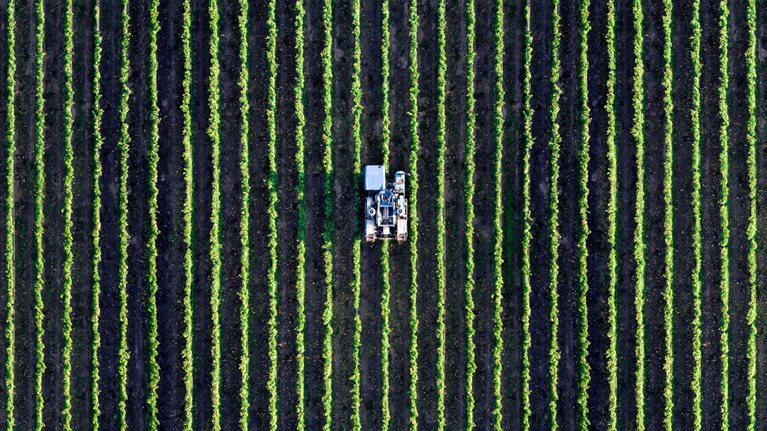 Vehicle ploughing a field