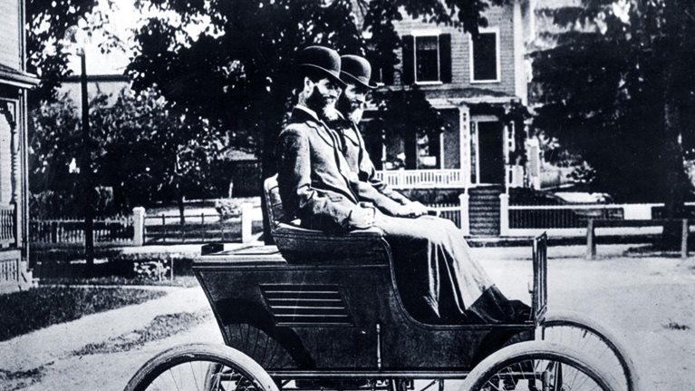 Portrait of twins and automobile manufacturers Freelan (1849-1940) and Francis Stanley (1849-1918) as they pose in their Stanley Steamer car, 1897.