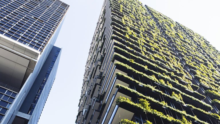 Low angle view of apartment building with vertical garden