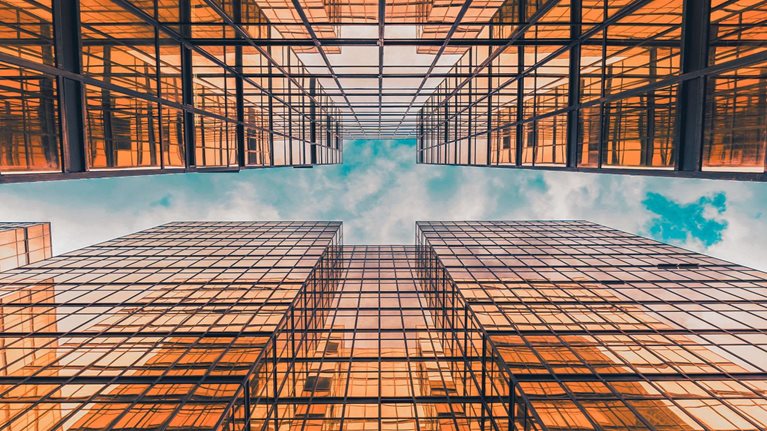 Time lapse Uprisen angle of Hong Kong skyscraper with reflection of clouds among high buildings - stock video