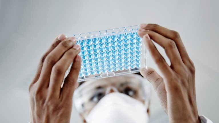 Woman examining laboratory samples