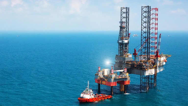 Oil platform in middle of ocean - stock photo