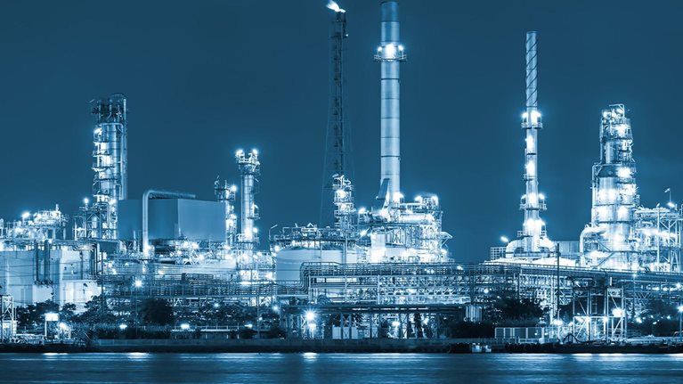 Oil refinery at night - stock photo
