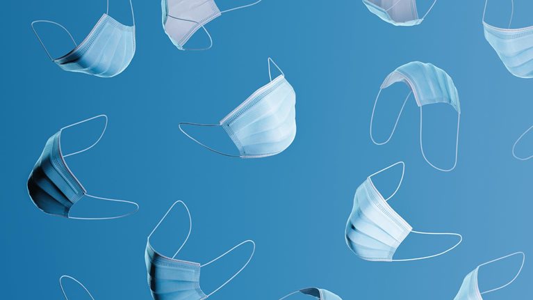 Many blue surgical masks floating on a blue background