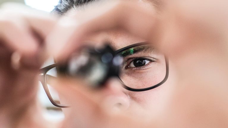 Worker looking at a microchip