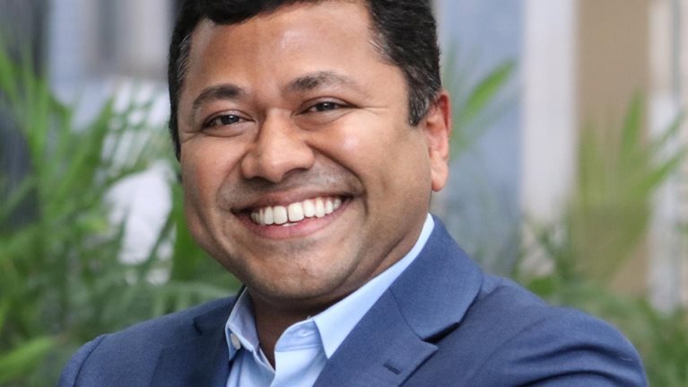 A smiling portrait of Matt Elenjickal