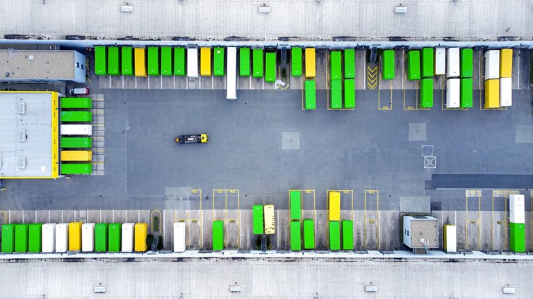 Aerial view of a distribution logistics building parking lot.