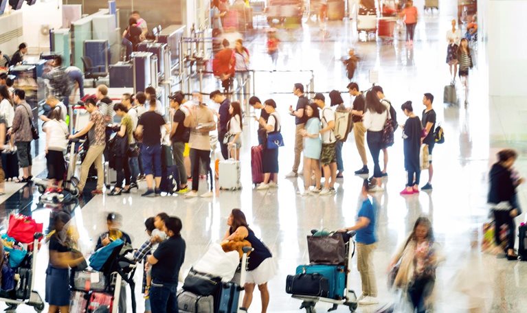 Crowd of people waiting for check-in - stock photo