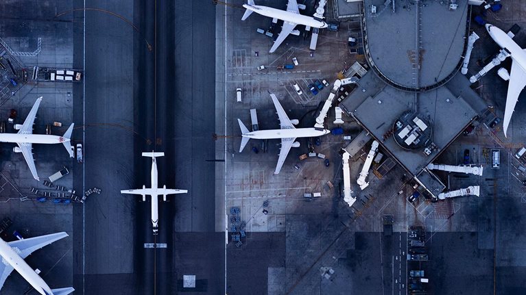 Airliners at gates and Control Tower at LAX - stock photo