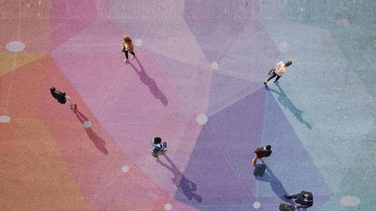 Top view of people walking in different directions of pattern, painted on asphalt - stock photo