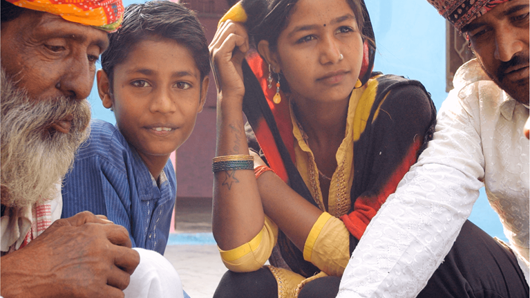 Image showing people from various ages gathered around as part of a community to illustrate how six years of higher quality life for everyone is within reach in the report titled “Adding years to life and life to years"